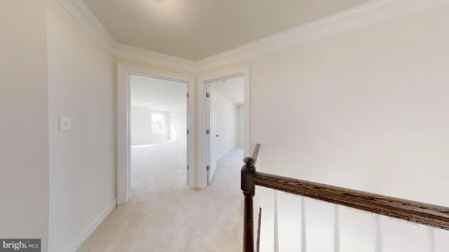 a view of an empty room and closet area