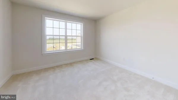 an empty room with closet area