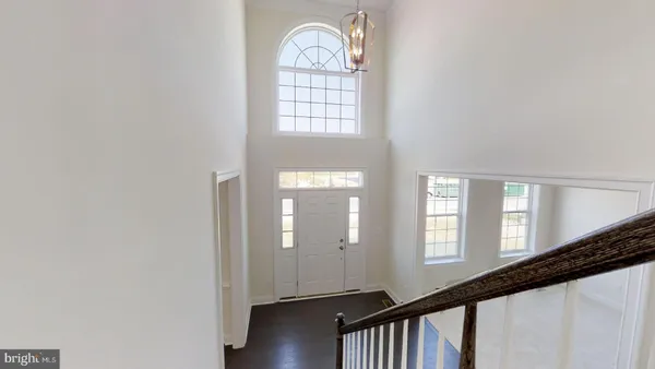 a view of an entryway with wooden floor