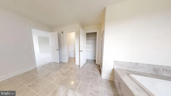 a view of a bathroom from the hallway