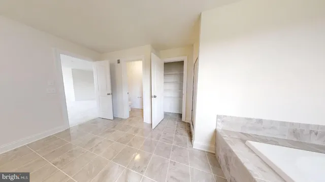 a view of a bathroom from the hallway