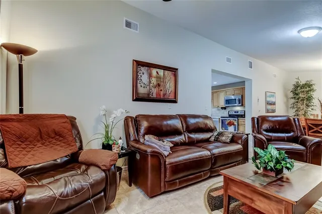 a living room with furniture and a couch