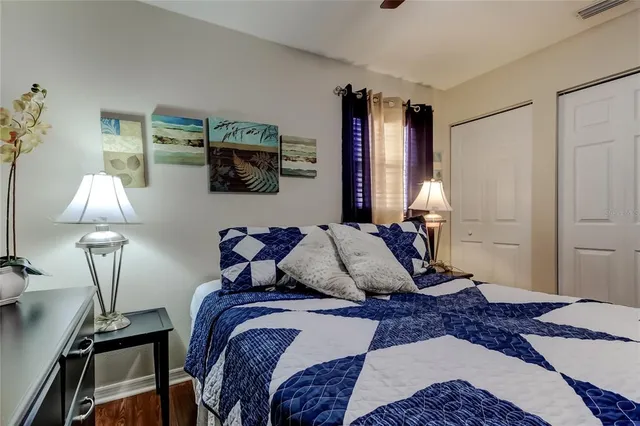 a bedroom with a bed and a lamp