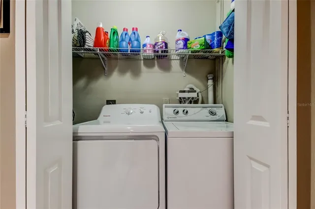 a utility room with dryer and washer
