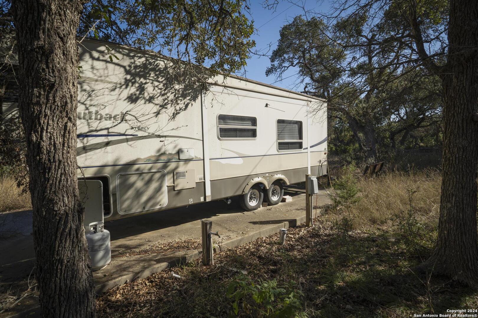 6511 Farm To Market Road 311 Spring Branch, TX 78070 - Photo 17 of 50 a view of house with a yard