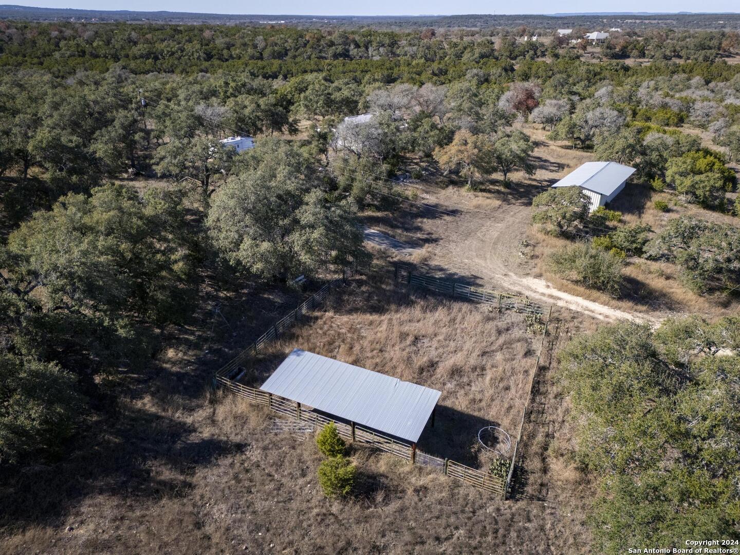 6511 Farm To Market Road 311 Spring Branch, TX 78070 - Photo 21 of 50 a view of a yard with wooden floor