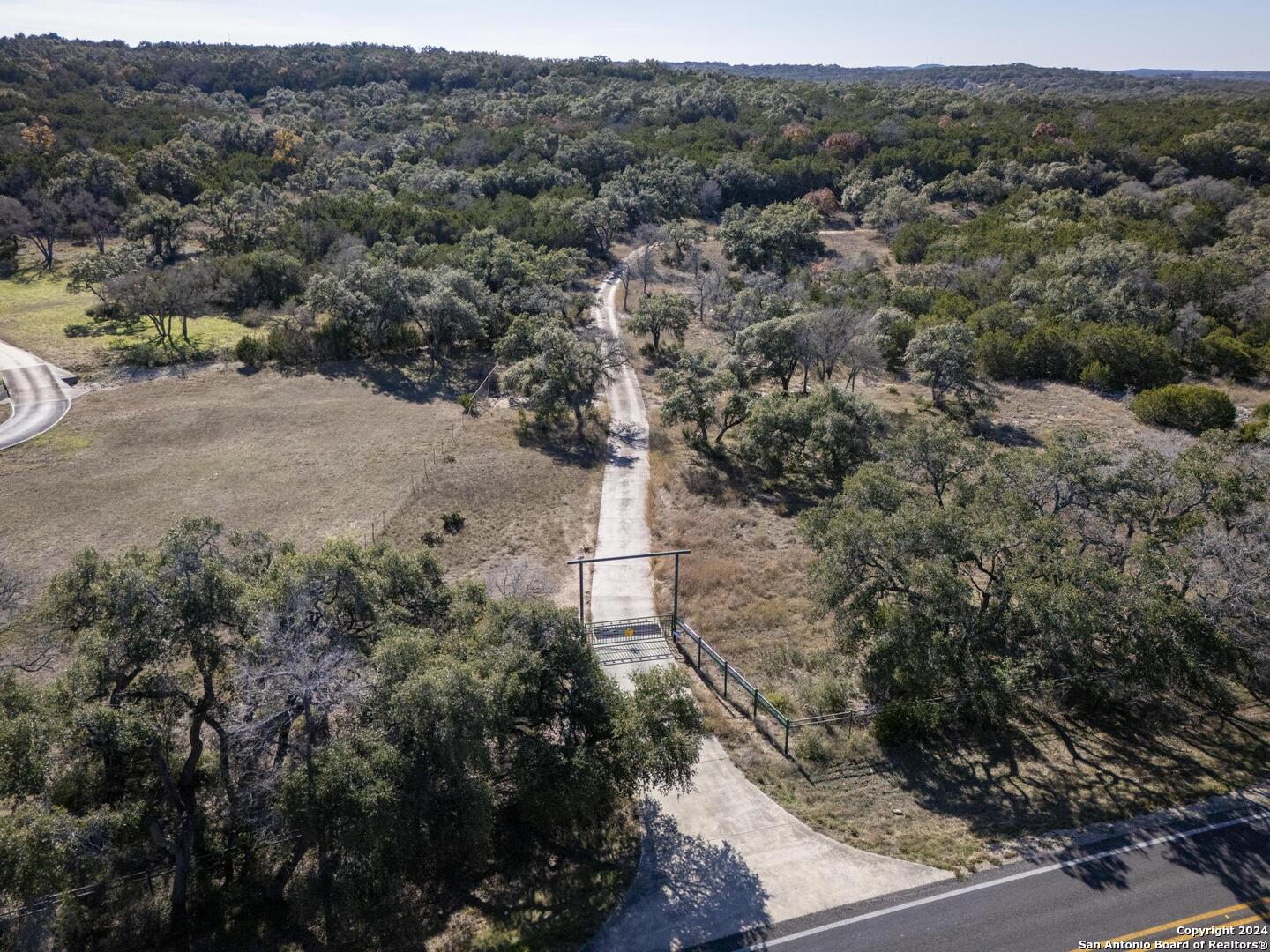 6511 Farm To Market Road 311 Spring Branch, TX 78070 - Photo 6 of 50 an aerial view of a houses with a yard