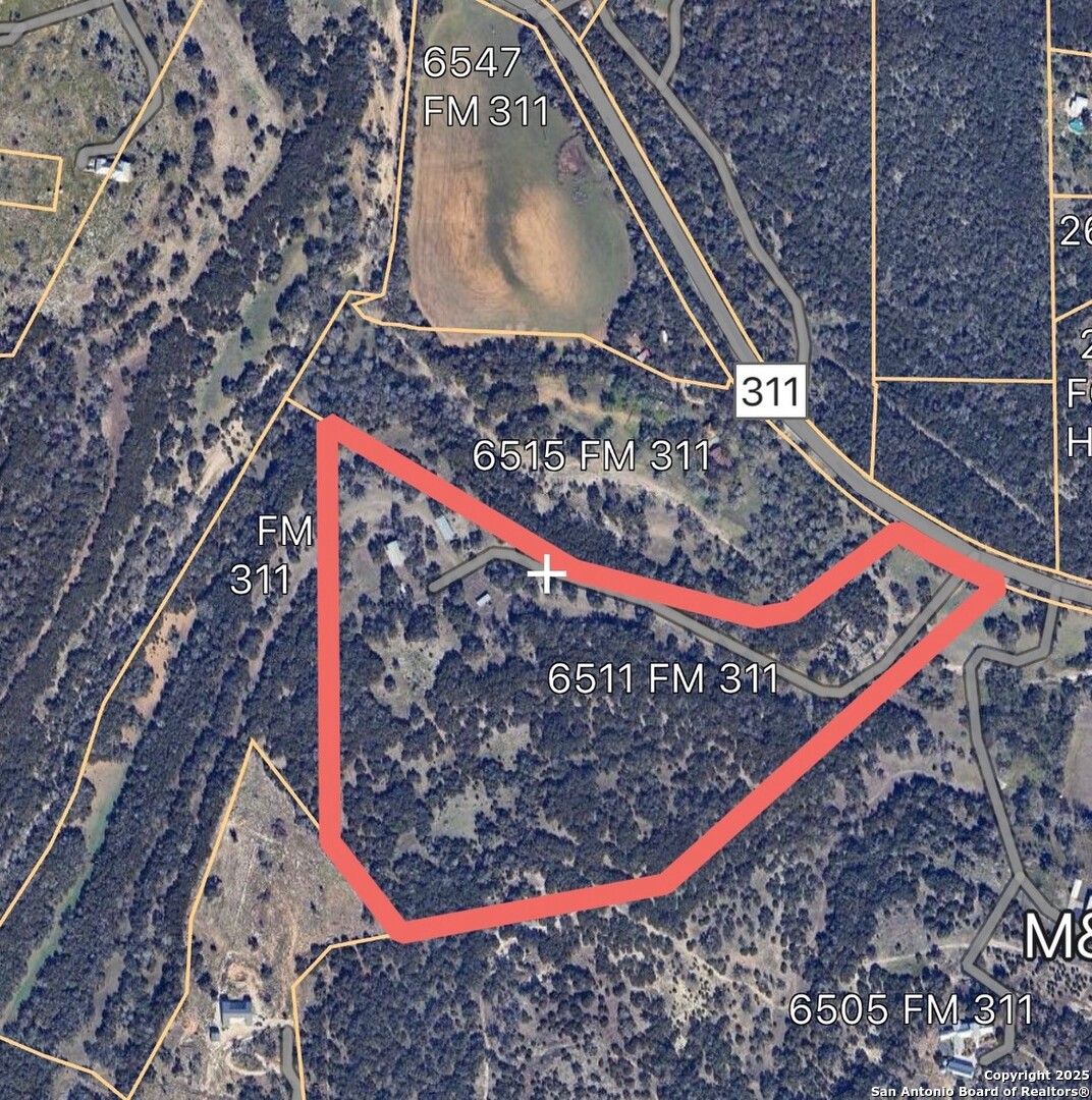 6511 Farm To Market Road 311 Spring Branch, TX 78070 - Photo 7 of 50 a view of a wooden bench with a wooden bench