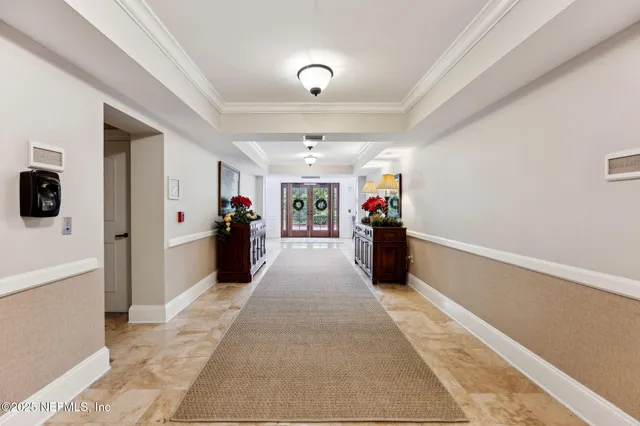 a large kitchen with stainless steel appliances granite countertop a refrigerator and a sink