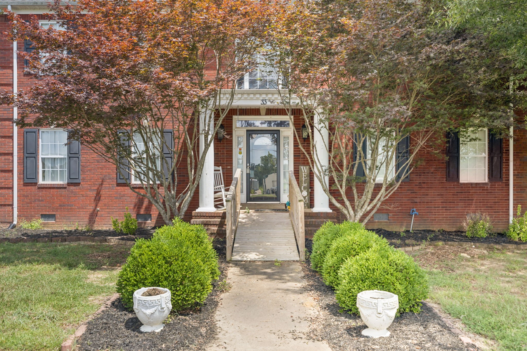33 Bishop Road Lawrenceburg, TN 38464 - Photo 43 of 87 a front view of a house with garden