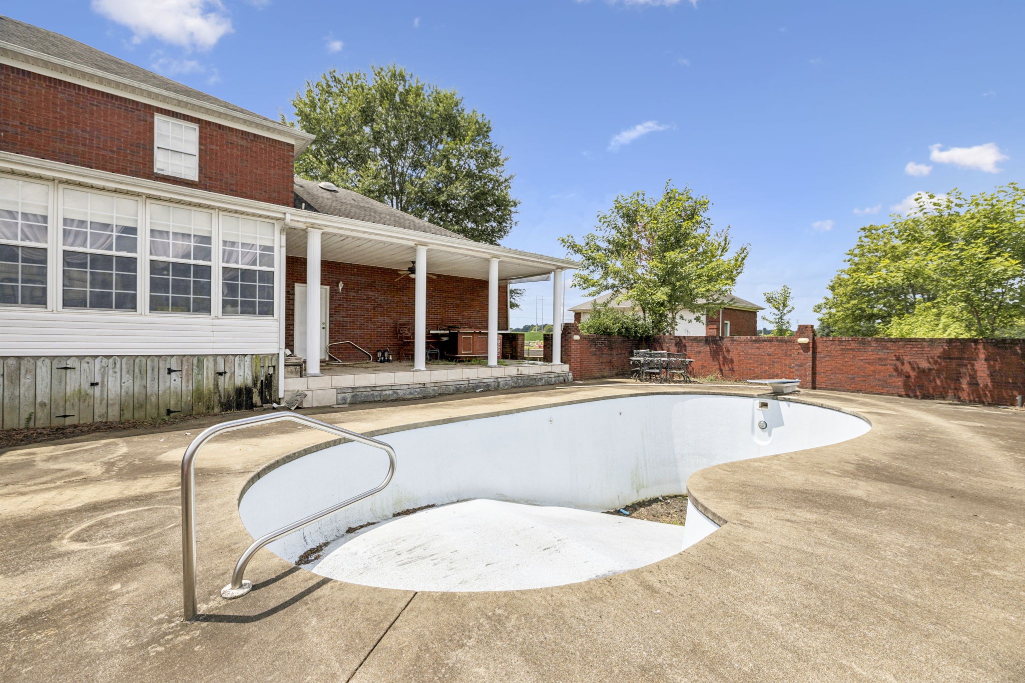 33 Bishop Road Lawrenceburg, TN 38464 - Photo 57 of 87 a view of a house with swimming pool and sitting area