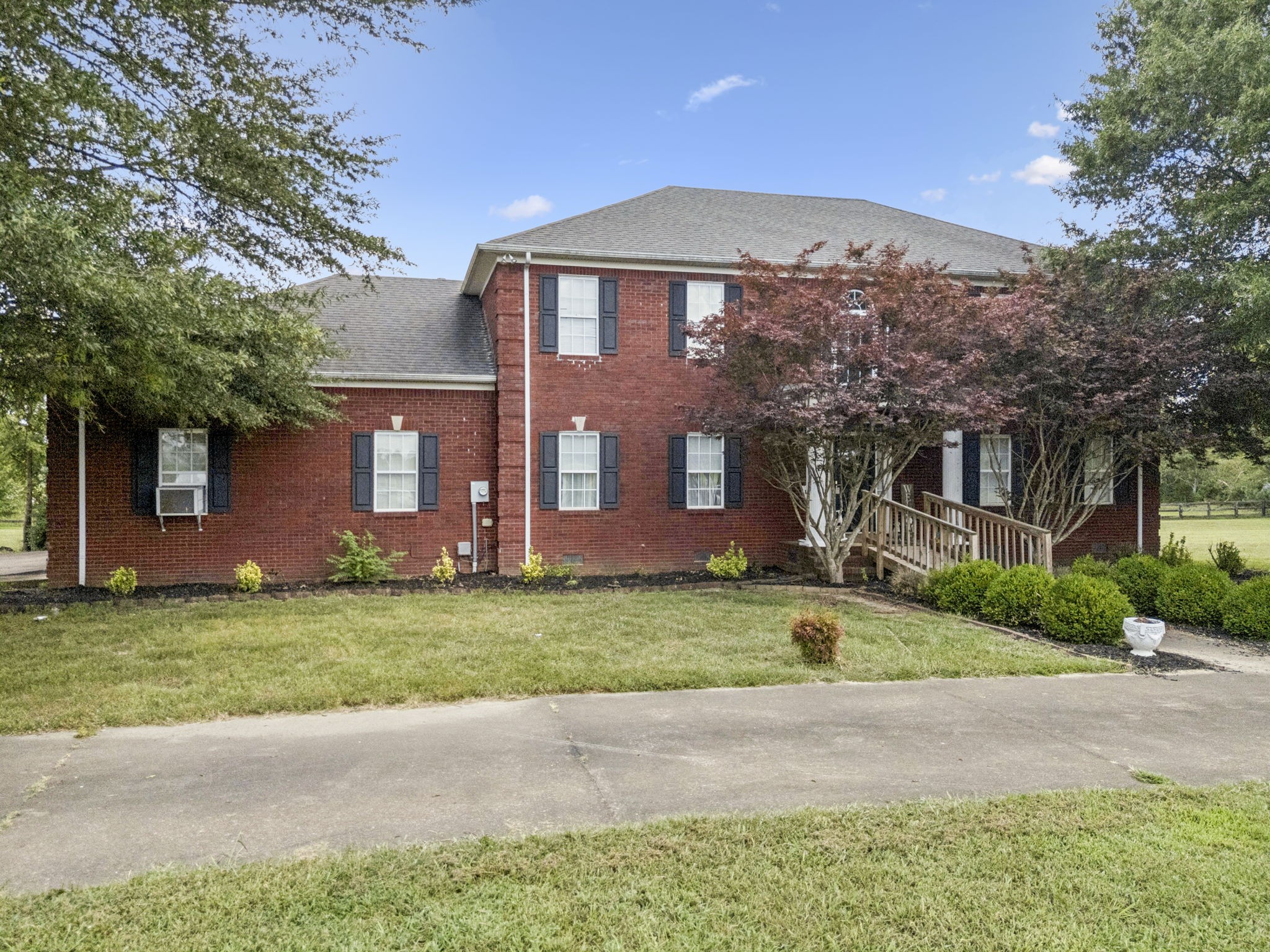 33 Bishop Road Lawrenceburg, TN 38464 - Photo 63 of 87 a front view of a house with a garden