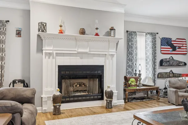 a living room with furniture and a fireplace