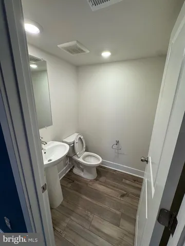 a bathroom with a toilet and a sink