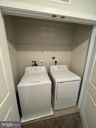 a utility room with dryer and washer