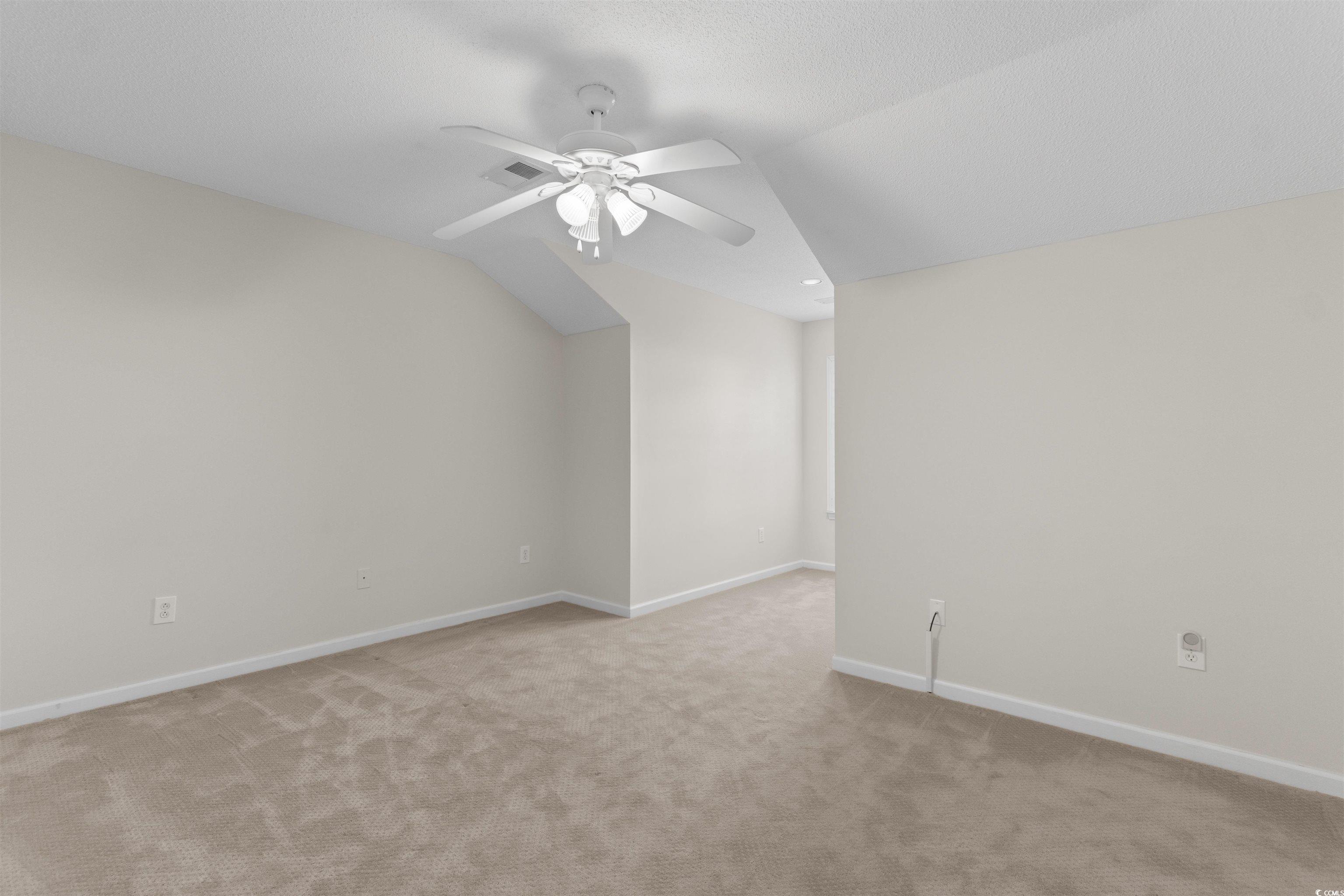 153 Wimbledon Way, Unit 153 Murrells Inlet, SC 29576 - Photo 25 of 32 Additional living space with vaulted ceiling, ceiling fan, and light carpet