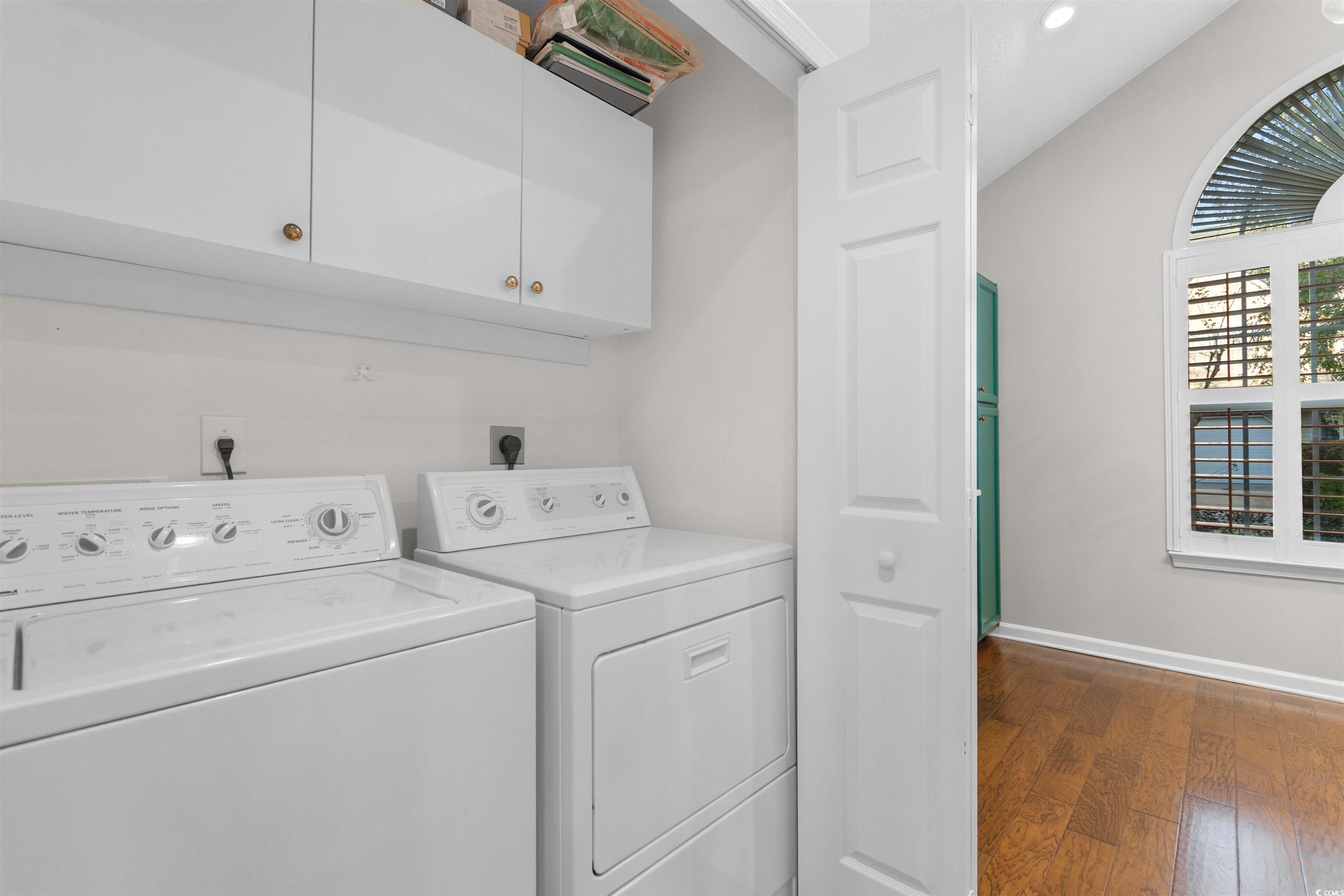 153 Wimbledon Way, Unit 153 Murrells Inlet, SC 29576 - Photo 26 of 32 Washroom with washing machine and clothes dryer, dark wood finished floors, cabinet space, and recessed lighting