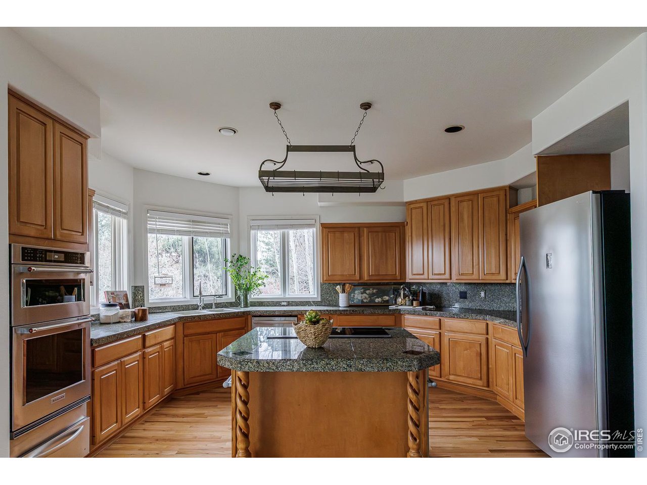 8461 Pawnee Lane Niwot, CO 80503 - Photo 9 of 31 Breakfast counter at kitchen center island