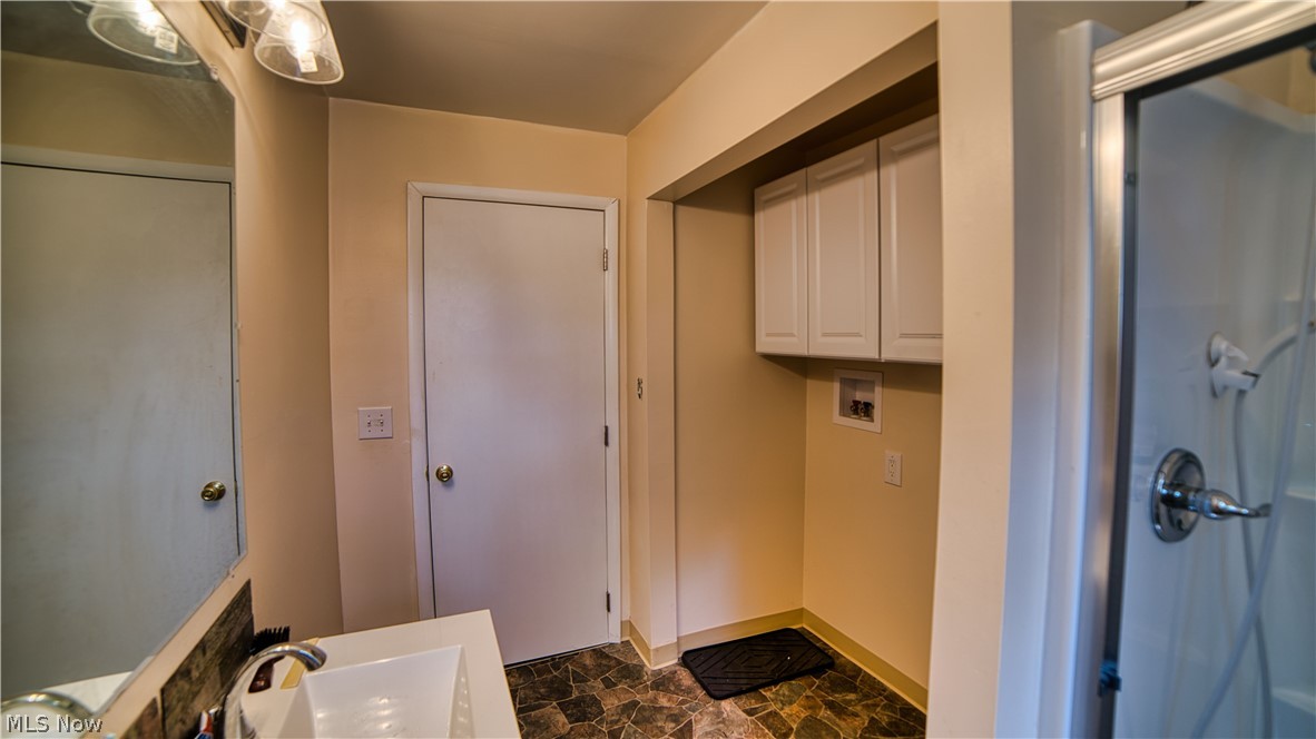 160 Welton Road Conneaut, OH 44030 - Photo 14 of 16 Bathroom featuring vanity and tile patterned floors