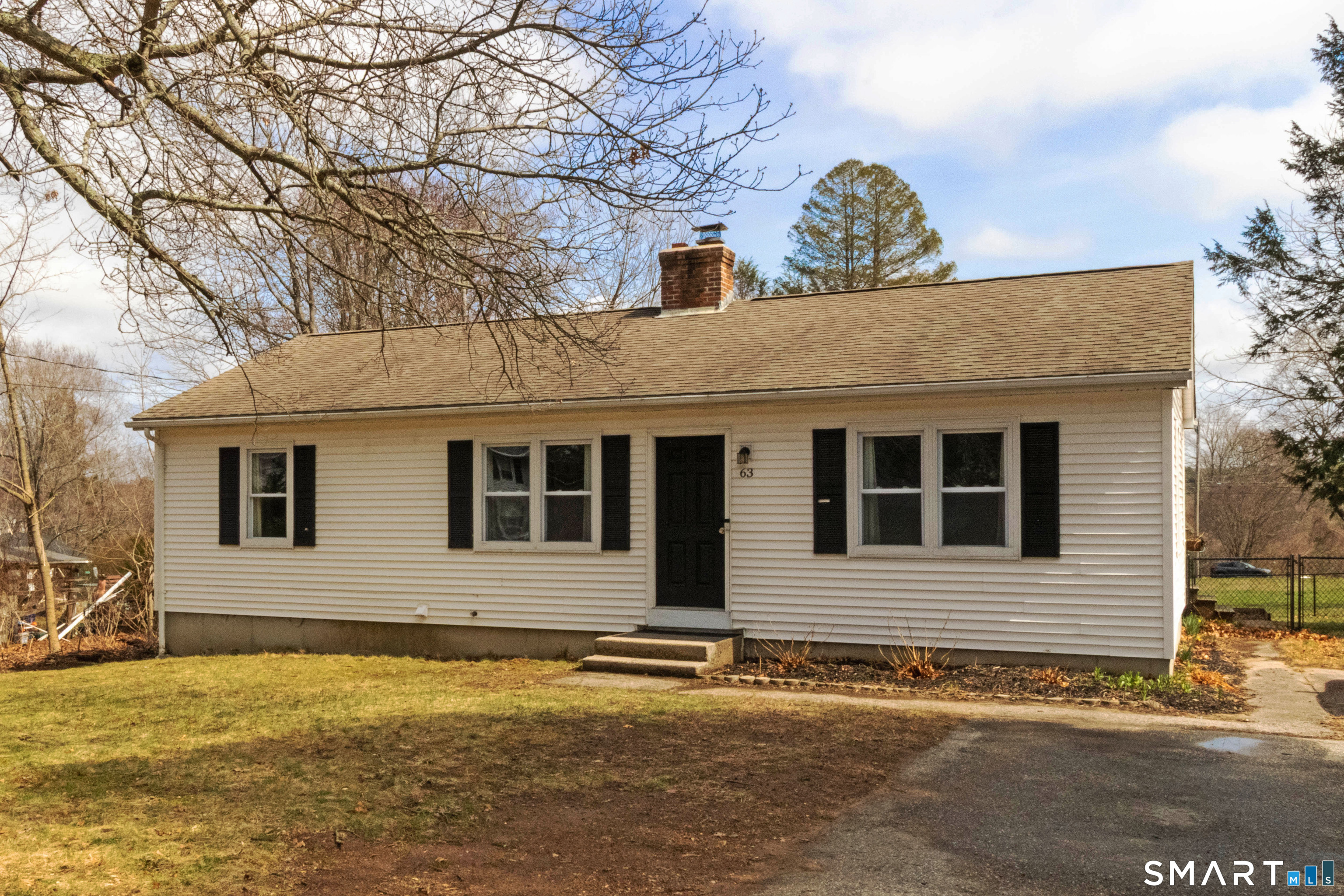 63 Whittemore Street Windham, CT 06226 - Photo 1 of 1 a house that has a tree in front of it