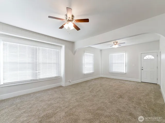 a view of an empty room with a window