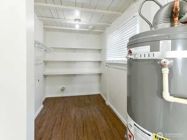 a view of a room with wooden floor