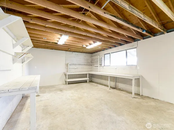 a view of an empty room with windows