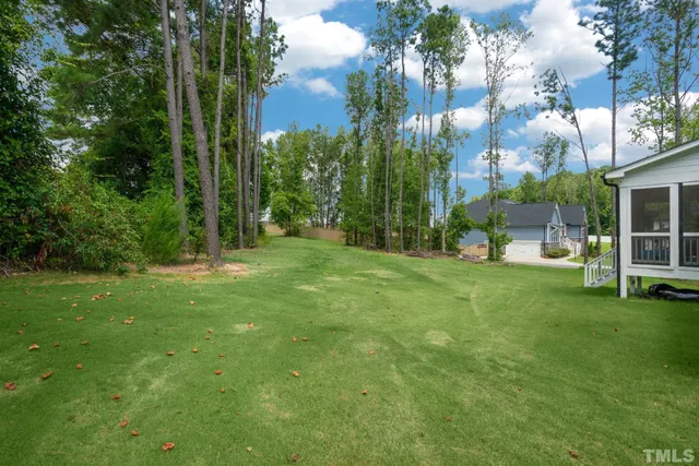 a view of a garden with a building in the background