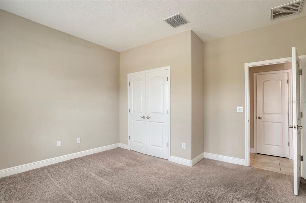 12690 Vander Way New Port Richey, FL 34654 - Photo 9 of 22 a view of an empty room and closet area