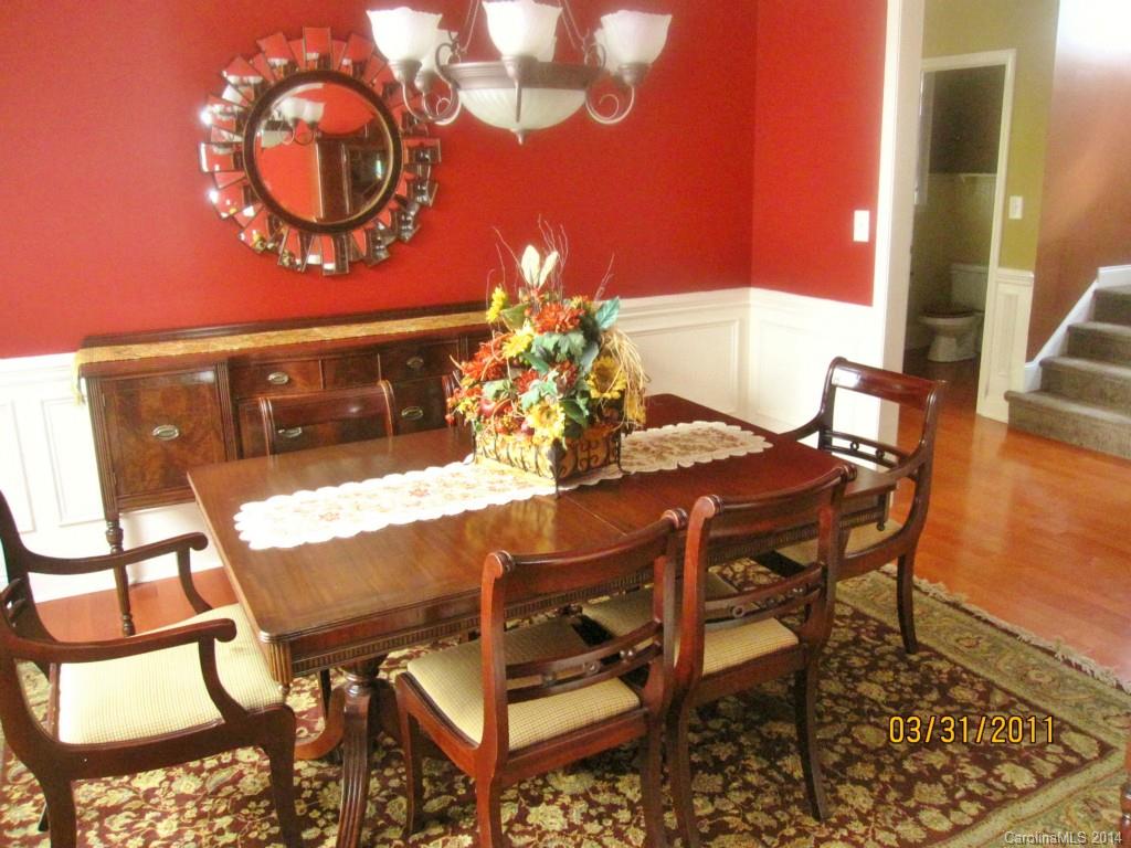 10010 Westmoreland Road Cornelius, NC 28031 - Photo 2 of 9 a view of a dining room with furniture and chandelier