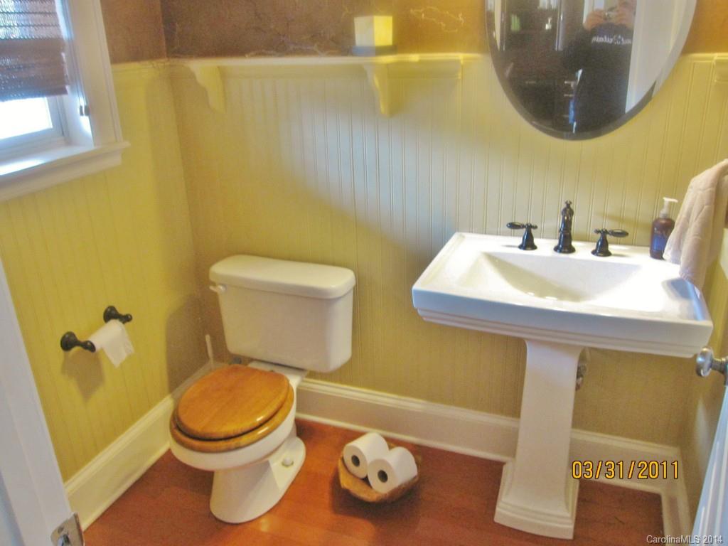 10010 Westmoreland Road Cornelius, NC 28031 - Photo 4 of 9 a bathroom with a sink and a mirror