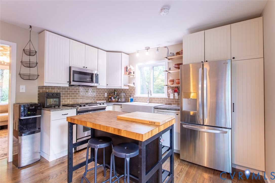 4157 New Market Road Henrico, VA 23231 - Photo 12 of 43 Kitchen featuring butcher block counters, stainles