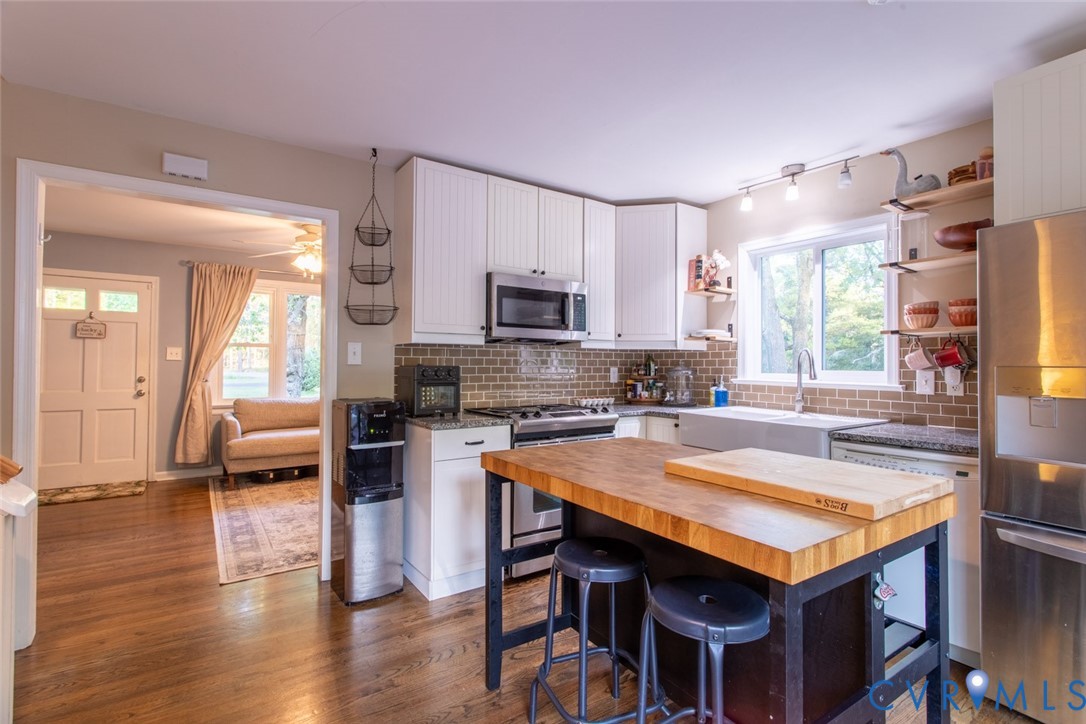 4157 New Market Road Henrico, VA 23231 - Photo 13 of 43 Kitchen with stainless steel appliances, white cab