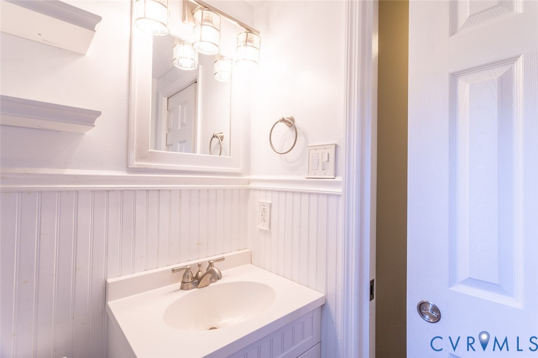 4157 New Market Road Henrico, VA 23231 - Photo 18 of 43 Bathroom featuring vanity and a wainscoted wall