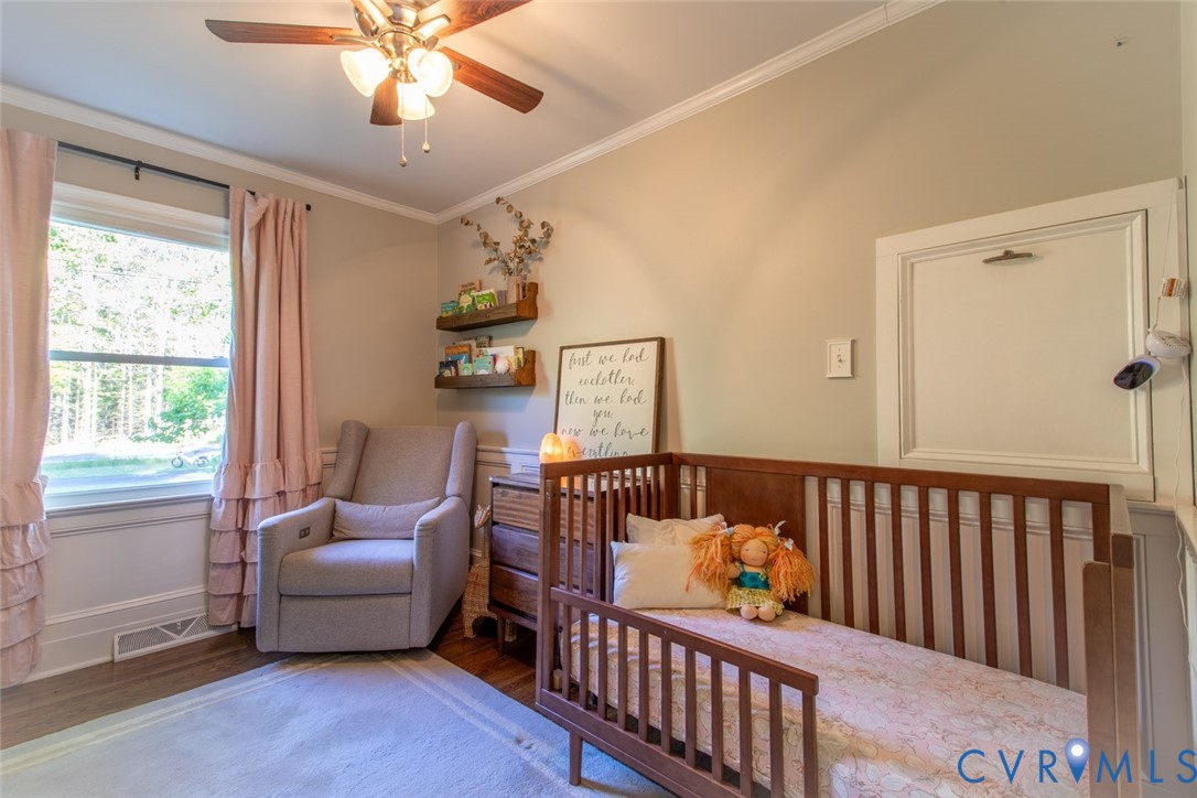 4157 New Market Road Henrico, VA 23231 - Photo 24 of 43 Bedroom featuring wood finished floors, crown mold