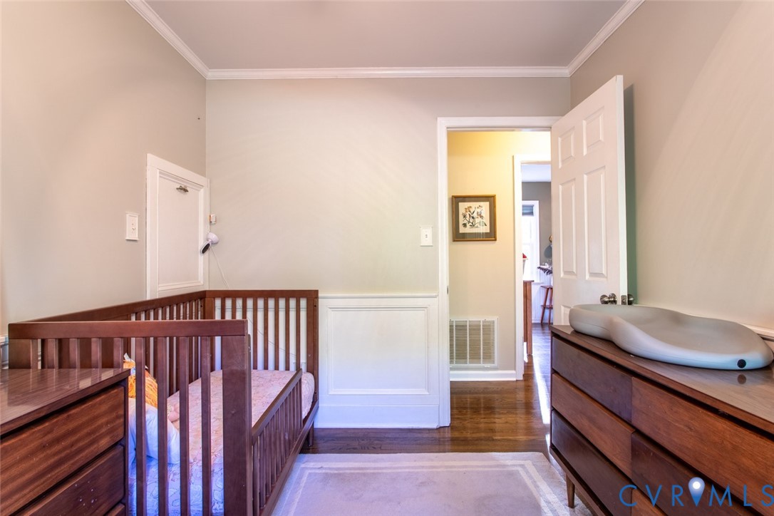 4157 New Market Road Henrico, VA 23231 - Photo 26 of 43 Bedroom with dark wood-style flooring, crown moldi