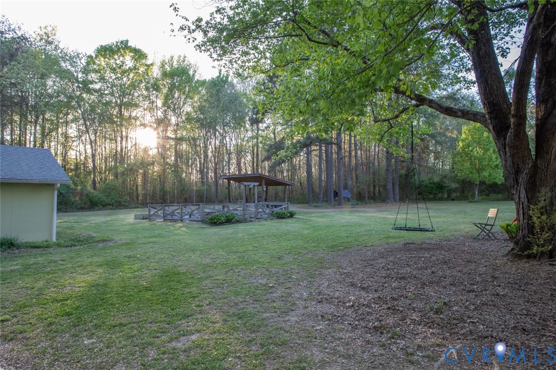 4157 New Market Road Henrico, VA 23231 - Photo 39 of 43 View of green lawn with view of scattered trees