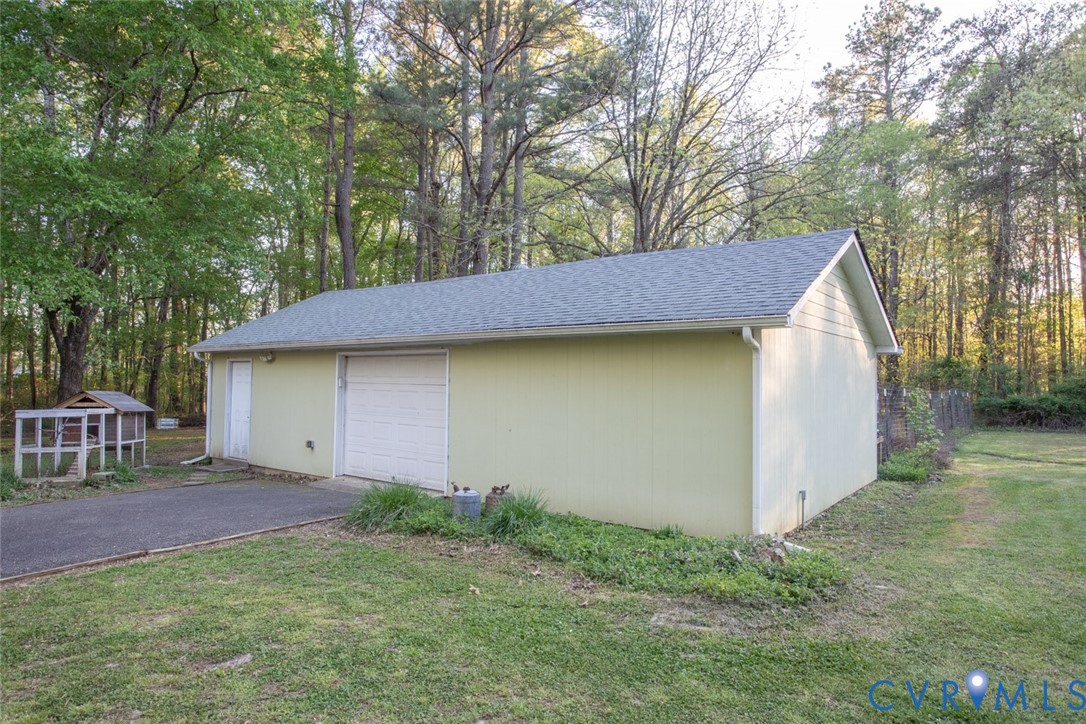 4157 New Market Road Henrico, VA 23231 - Photo 40 of 43 Detached garage with asphalt driveway and view of
