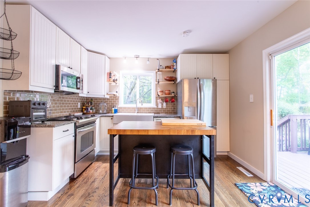 4157 New Market Road Henrico, VA 23231 - Photo 9 of 43 Kitchen with stainless steel appliances, butcher b