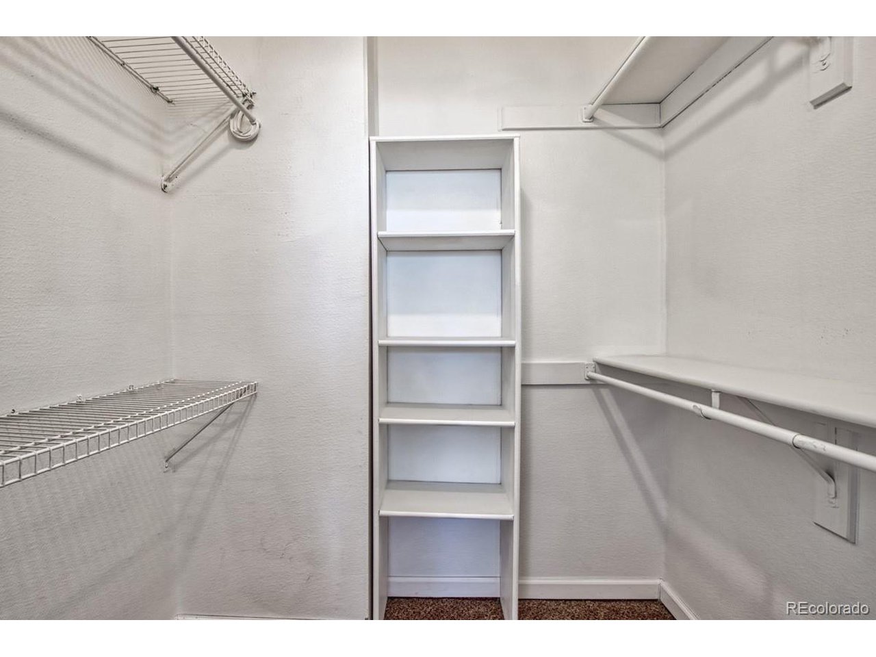 8701 Huron Street, Unit 209 Thornton, CO 80260 - Photo 12 of 25 a view of a room with racks on the wall