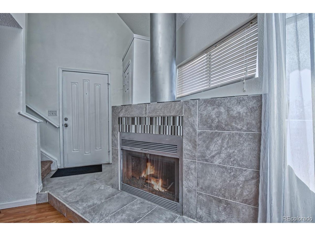 8701 Huron Street, Unit 209 Thornton, CO 80260 - Photo 6 of 25 a view of empty room with a fireplace