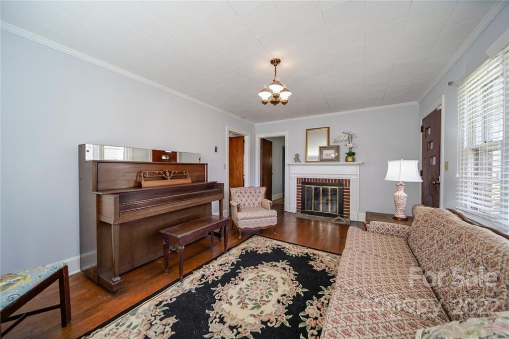 553 Loray Farm Road Dallas, NC 28034 - Photo 19 of 48 a living room with furniture and a fireplace