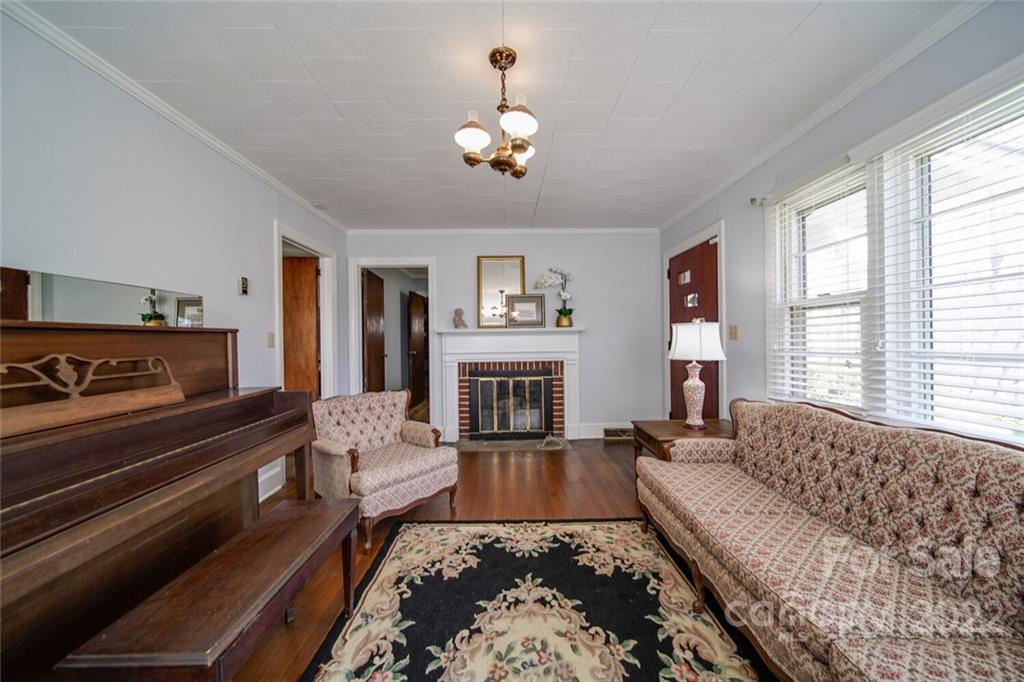 553 Loray Farm Road Dallas, NC 28034 - Photo 20 of 48 a living room with furniture and a fireplace
