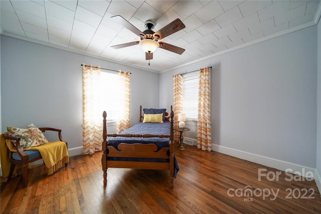 553 Loray Farm Road Dallas, NC 28034 - Photo 32 of 48 a bedroom with furniture and wooden floor