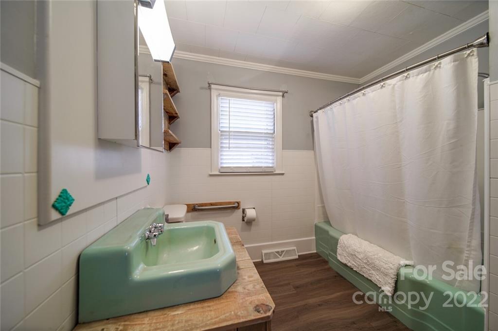 553 Loray Farm Road Dallas, NC 28034 - Photo 33 of 48 a bathroom with a sink and a window
