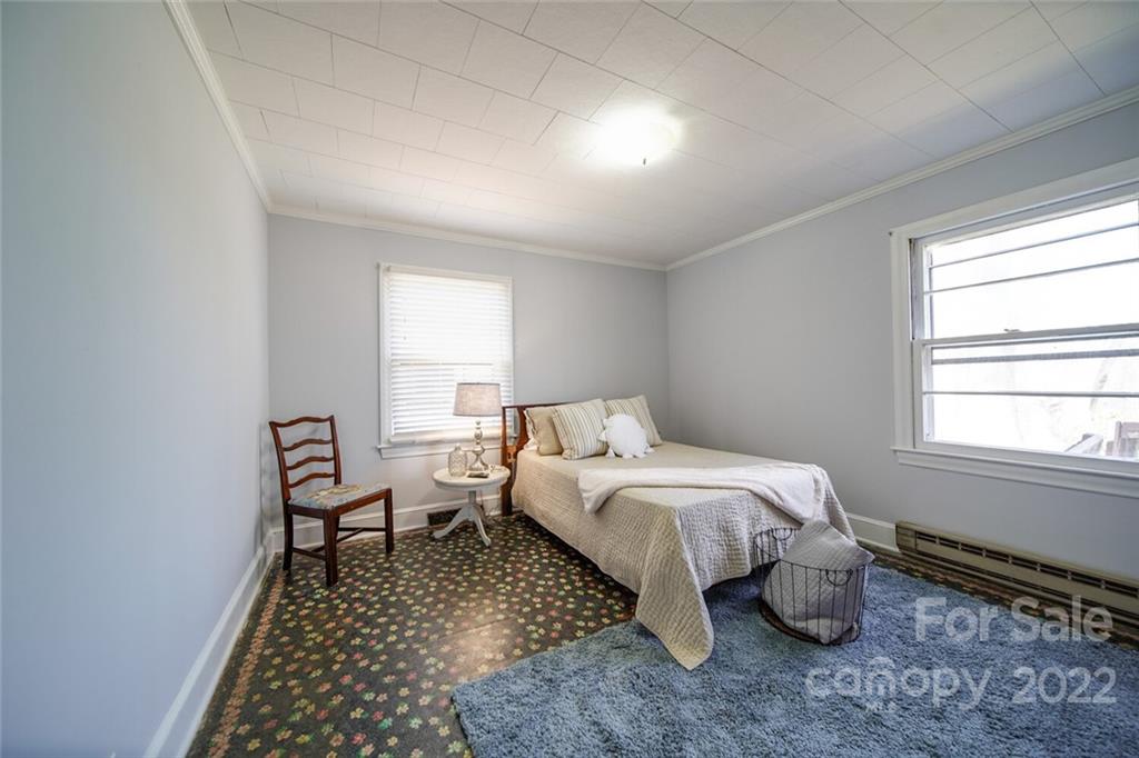 553 Loray Farm Road Dallas, NC 28034 - Photo 40 of 48 a bedroom with a bed and a window