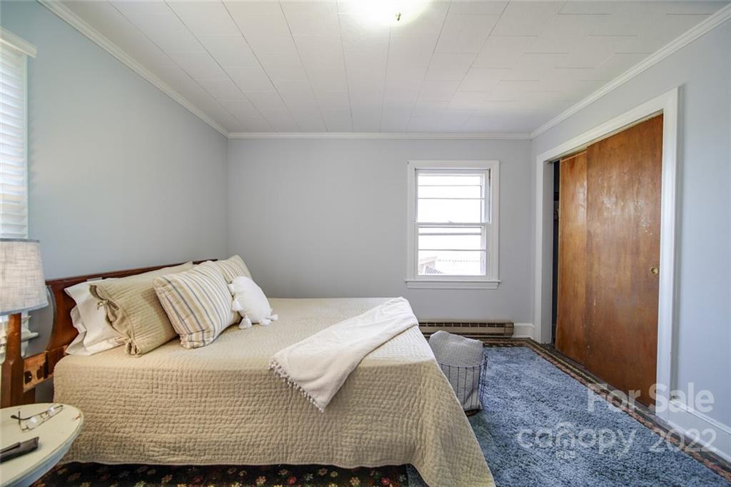 553 Loray Farm Road Dallas, NC 28034 - Photo 41 of 48 a bedroom with a bed and a window