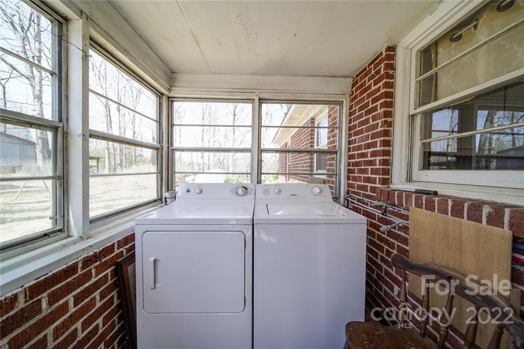 553 Loray Farm Road Dallas, NC 28034 - Photo 43 of 48 a view of a room that has a bed and a large window