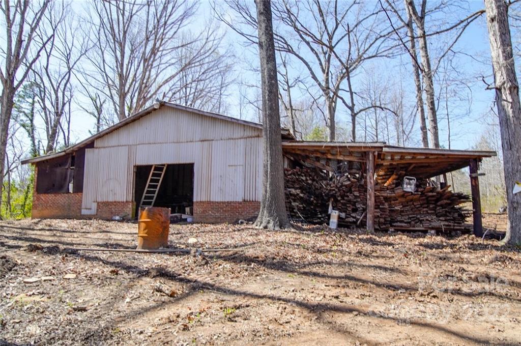 553 Loray Farm Road Dallas, NC 28034 - Photo 7 of 48 a view of a house with snow on the side of the house