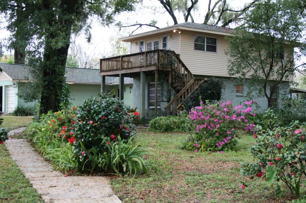 802 Limona Road Brandon, FL 33510 - Photo 1 of 1 a front view of a house with a yard and potted plants